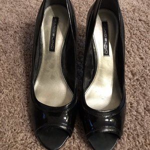Black satin pumps